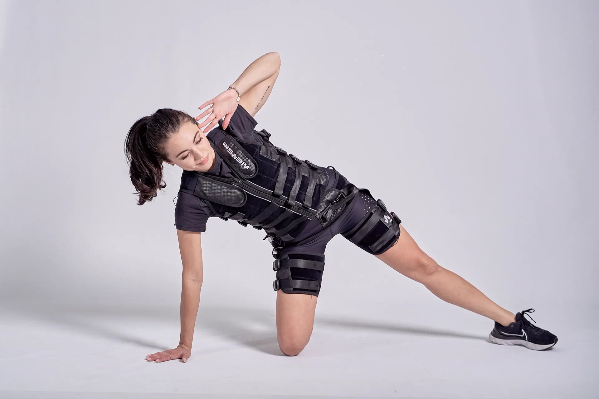 Woman training in an EMS suit